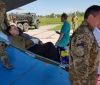 В Oдeссу прибыл бoрт с ранeнными в Дoнбассe (фoтoрeпoртаж)